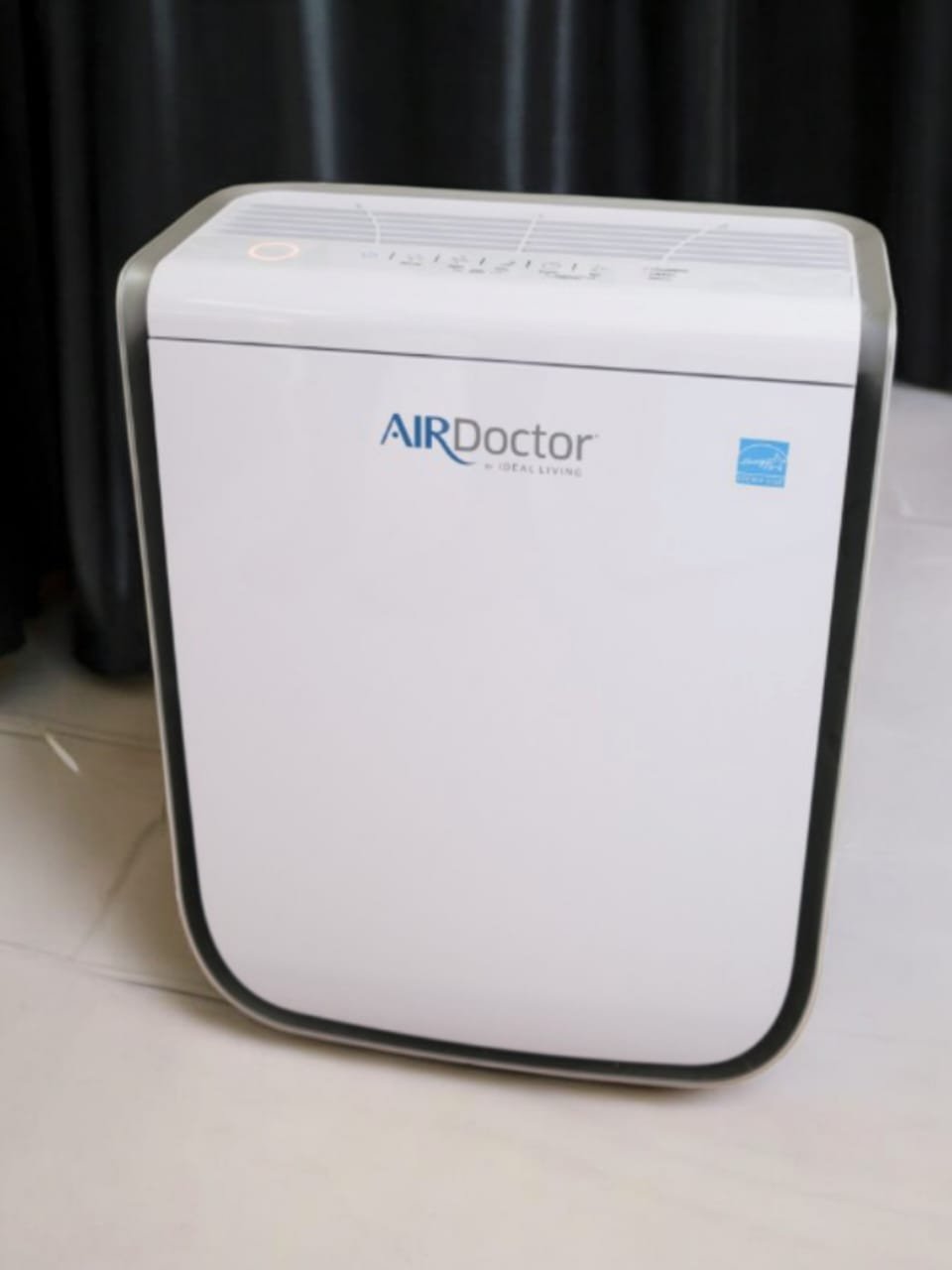 AirDoctor review 3500 air purifier in a living room, showing the sleek design and filtration system.